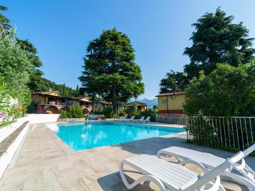 Villaggio Sanghen House | Apartment on Lake Garda with pebble beach, pier for boat, three swimming pools