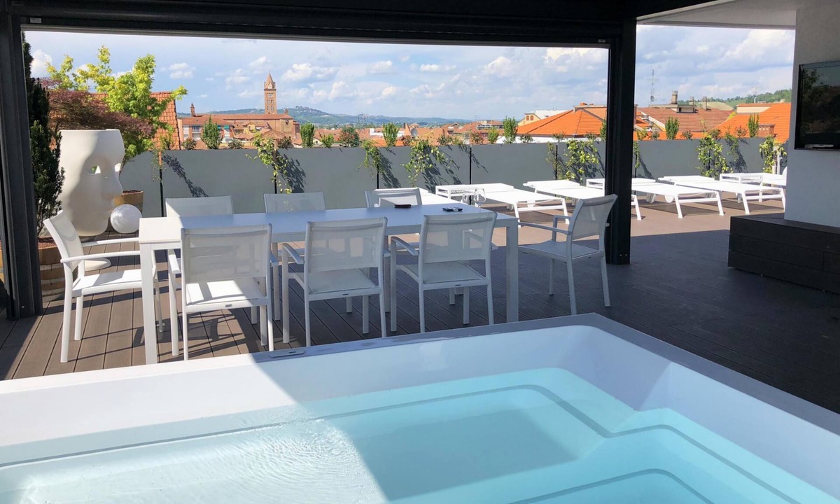 Alba Apartment | Exclusive penthouse in the historic center of Alba, panoramic terrace with garden and private pool and solarium.