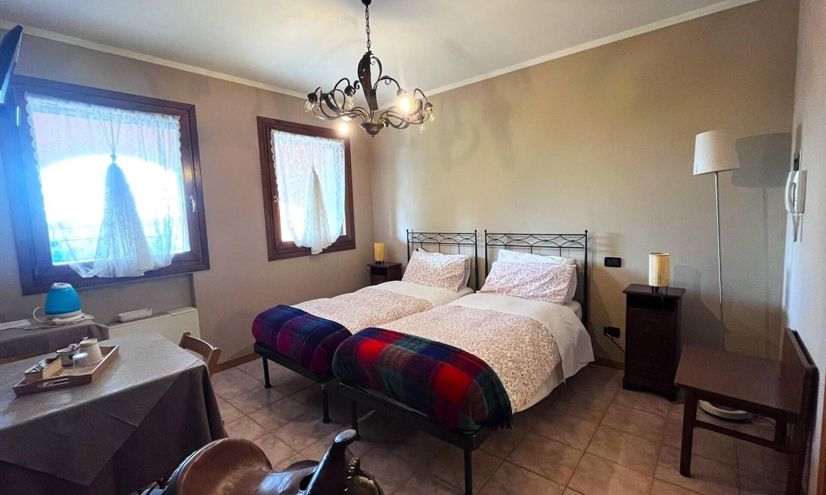 Santa Maria di Sala Apartment | Papaveri E Papere Room – Selleria Style in Caltana