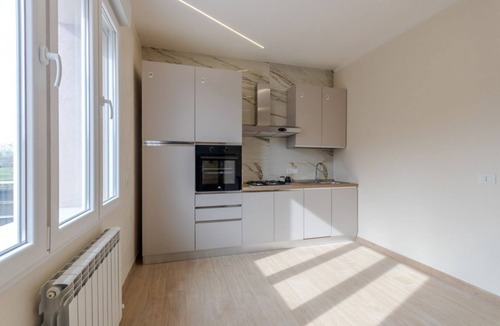 Tessera Apartment | A bright and welcoming 90 square meters apartment, perfect for seven people, located on the first floor of a building without an elevator.The property is located in Tessera, a suburb close to Marco Polo Airport. The location is also ideal for reaching Ve