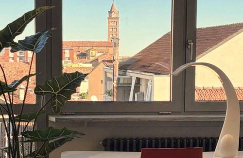 Alba Apartment | Exclusive penthouse in the historic center of Alba, panoramic terrace with garden and private pool and solarium.