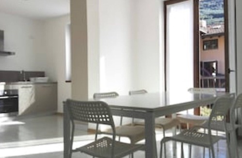 Riva del Garda Apartment | Flat with garden in quiet green neighborhood, 2 bikes, storage, private parking