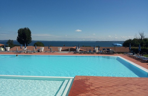 Solarolo Apartment | Montecolo Resort three-room apartment with splendid lake view, swimming pool