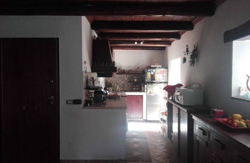 Campagnano di Roma Apartment | Rustic Elegance at Two Steps from Rome: Relaxation among Exposed Beams and Cotto