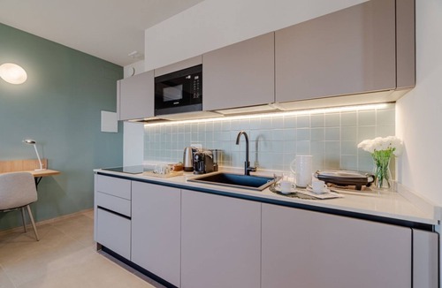 Lingotto Apartment | This large studio apartment is ideally located for exploring Turin, with easy access to the subway, allowing you to reach the city center in just a few minutes and the lively San Salvario neighborhood in even less time. Just steps from Parco del Po, the