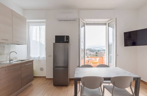 Cesana Brianza Apartment | Travel with your family and friends and explore lakes and mountains near Como!This spacious apartment, with two bedrooms, two bathrooms, open space kitchen with island, large living room, small terrace, is located on the road that connects the two main c