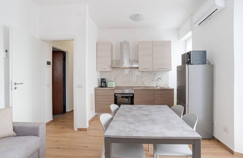 Cesana Brianza Apartment | Travel with your family and friends and explore lakes and mountains near Como!This spacious apartment, with two bedrooms, two bathrooms, open space kitchen with island, large living room, small terrace, is located on the road that connects the two main c