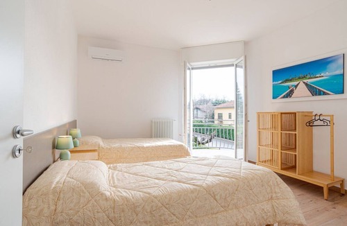 Cesana Brianza Apartment | Travel with your family and friends and explore lakes and mountains near Como!This spacious apartment, with two bedrooms, two bathrooms, open space kitchen with island, large living room, small terrace, is located on the road that connects the two main c