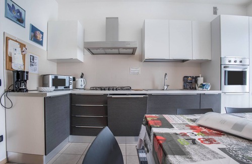 Riva del Garda Apartment | "Verde House 2" Apartment with Mountain Views, Balconies, Shared Garden, and Wi-Fi