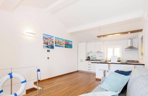 Nervi Apartment | “Vista Mare Genova”A two-level gem with a spectacular sea view, unique in the area.Lower floor: Bedroom with premium-quality mattress, bathroom, and a cozy corner with table and chess set overlooking the sea.Upper floor: Living room with sofa bed, fu