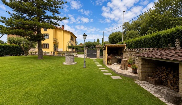 A 5-minute drive from Ostia, nestled in the beautiful setting of a pine forest—a family-friendly villa.