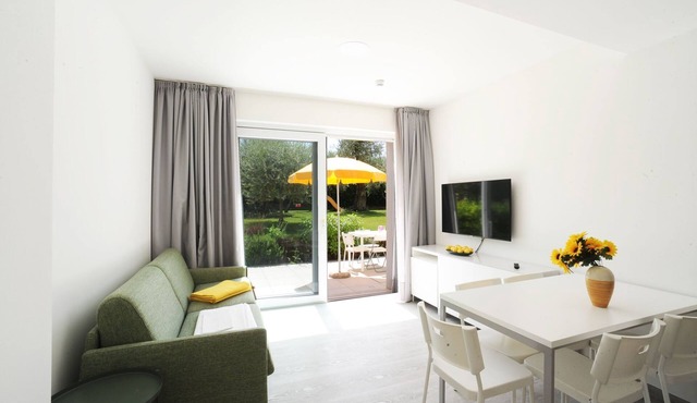 Dreizimmerwohnung mit direktem Zugang zum Garten by Interhome