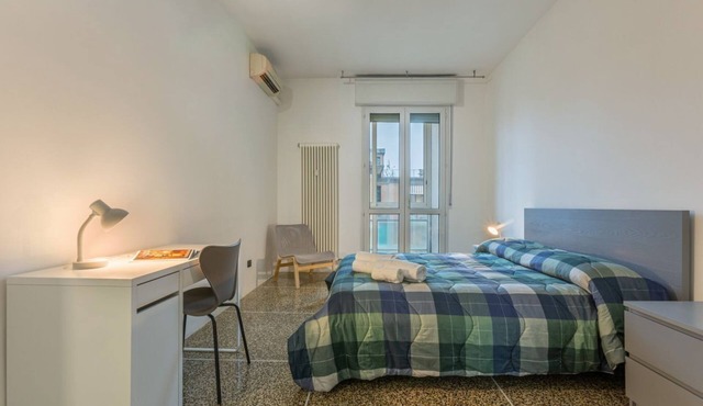 GuestHost - Cozy 70 mq apartment, perfect for two people, located on the sixth floor of a building with lift (NOT suitable for disabled people).The accommodation is located within the San Donato district, in a strategic position close to the Bologna Fair