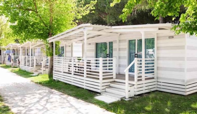 Mobile home with air conditioning and wooden veranda